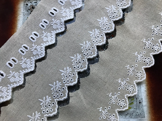 White Embroidery on Beige Color Linen.