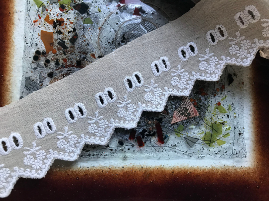 White Embroidery on Beige Color Linen.