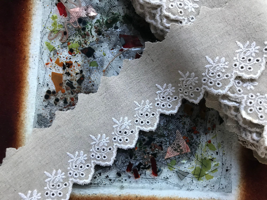 White Embroidery on Beige Color Linen.