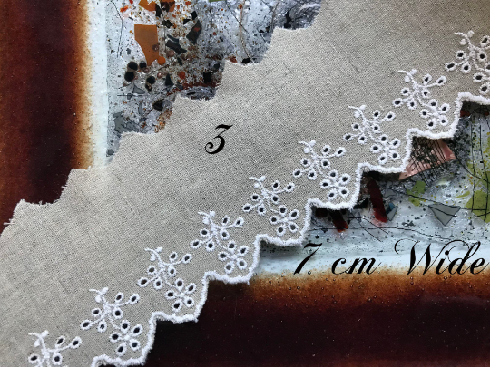 White Embroidery on Beige Color Linen.